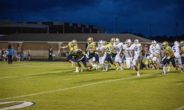 Independence and Summit high football teams run on field